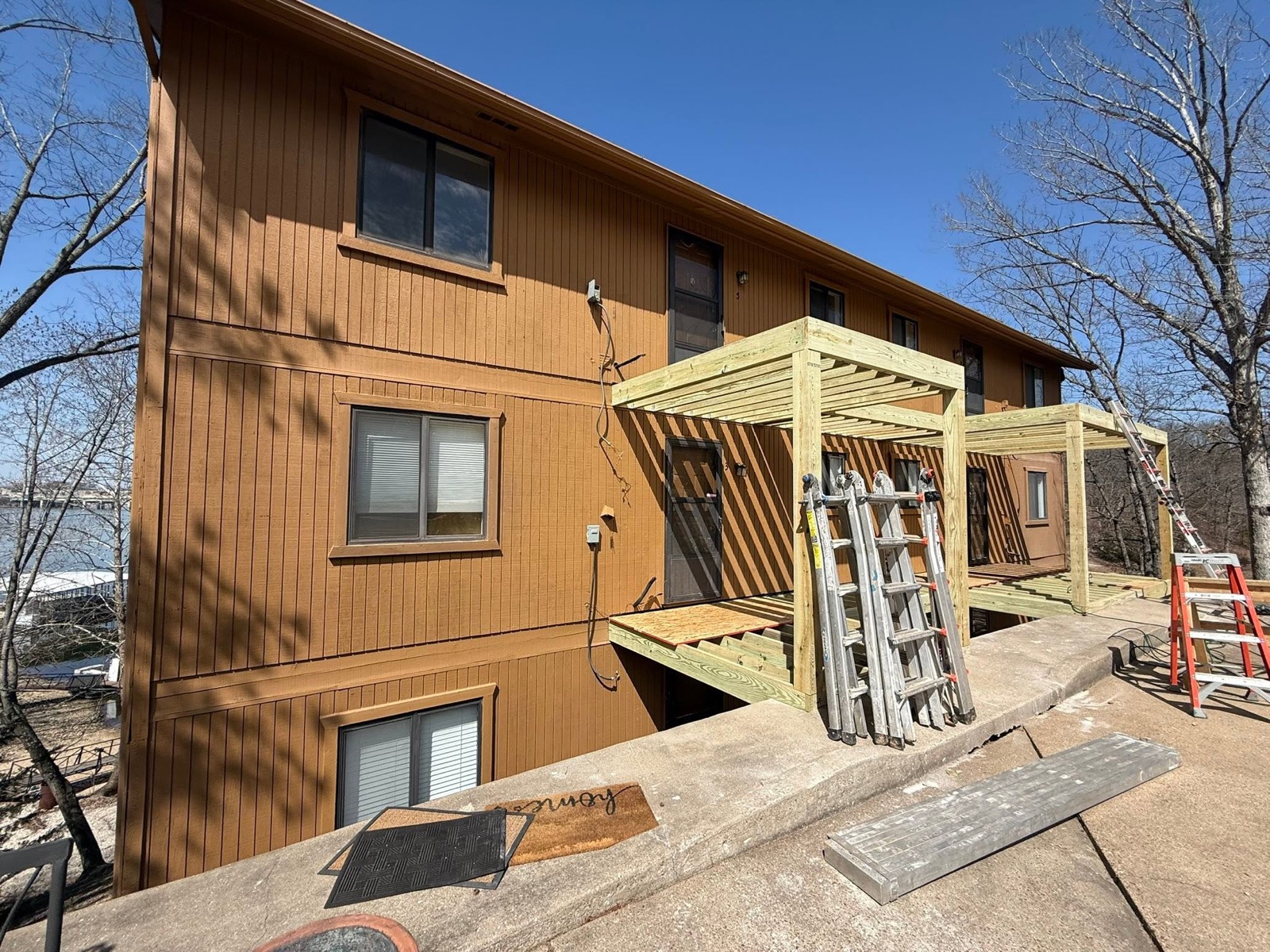 New pressure-treated deck framing on a lakefront building at Lake of the Ozarks by Ireland Construction